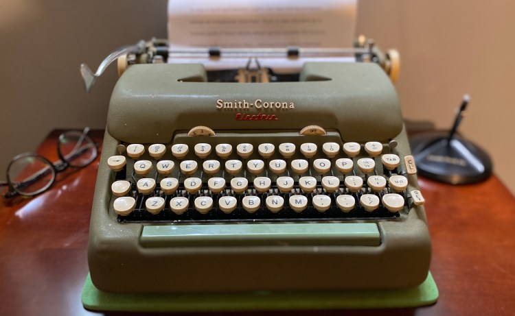 A picture of my mother’s old electric Smith-Corona typewriter, with a sheet of paper in the bail. The words on the paper are blurred. The picture conveys the idea, "Bring your story into focus," for the home page of Patrick F. O'Donnell's Editorial Services website.